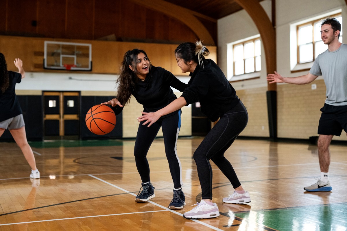teens playing basketball